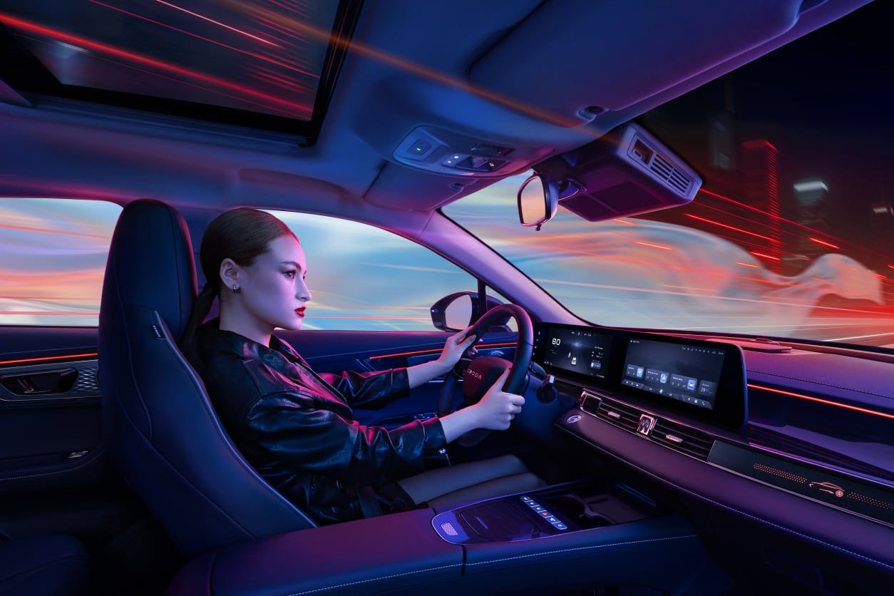 Woman driving OMODA 5 PHEV